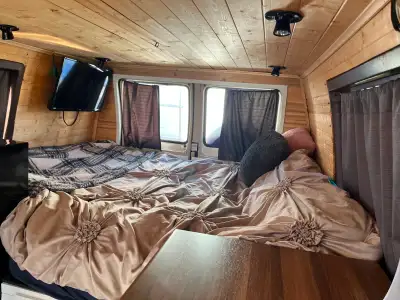Runs great, rust on exterior but mechanically solid. Converted to a sleeper van with: 4 solar panels...