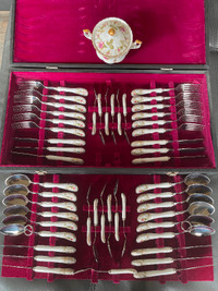 Set of polish porcelain vintage cutleries.
