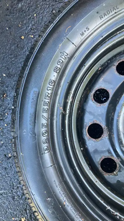 I am selling a used tire and rim, size P205/55R16 89H. The tire shows signs of wear but still has so...