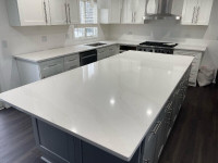 Professional quartz countertop, quartz backsplash, and cabinets