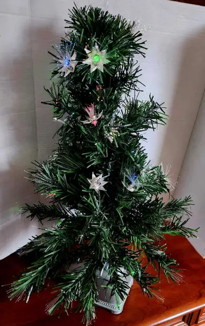 Add a festive touch to any space with this delightful, gently used, small fibre optic Christmas tree...