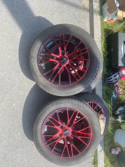 Selling my summer tires with red rims Tires have about 2 seasons left on them. Were used on a Honda...