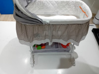 Newborn crib with a toy set