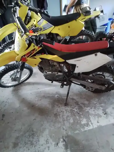 Looking to trade for a 80 or 85 2 stroke .New chains cables twist throttle rear tire grips.