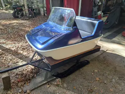 Refinished 1972 Aurele Marois snowmobile tow-behind passenger sleigh has a blue and white fiberglass...
