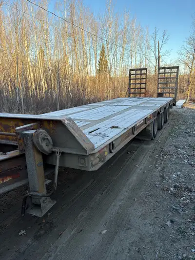 35 ton, 3 axle tag a long float. 30 ft deck, air brakes , hub piloted wheels.