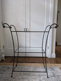 Metal table with glass shelves