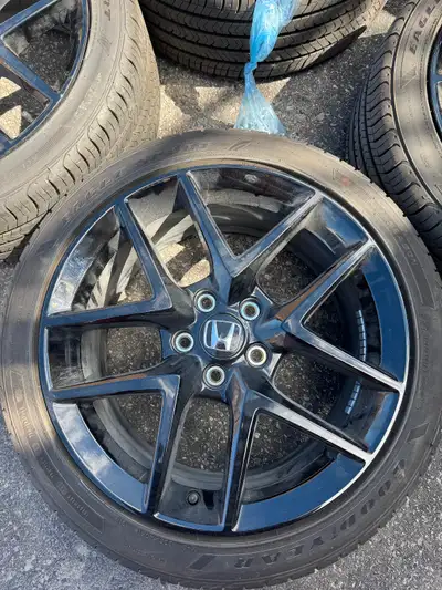 Selling Goodyear Eagle Sport all-season tires 235/40R18 these are mounted on 18-inch gloss-black all...