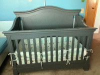 Grey baby crib