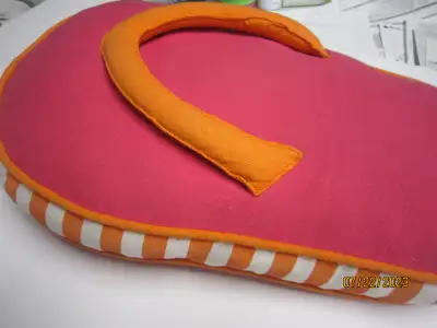 This is a FUN flip flop pillow. Approximately 17 inches long by 11 inches wide. Depth is 2 1/2 inche...