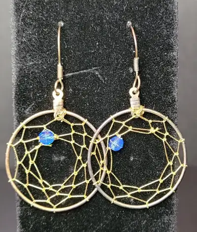 NEW Dream Catcher Earrings with gold threads and a blue bead. 1.25 inches in diameter.