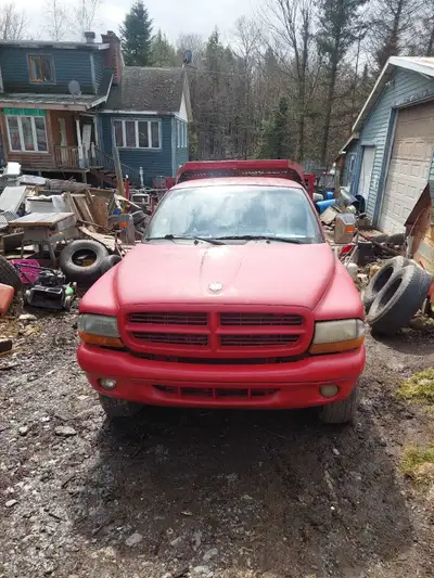 2000 dodge dakota 4x4 with dump box. The truck has automatic transmission. Truck needs new torque co...