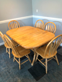 Solid Maple dinning table with 6 chairs.