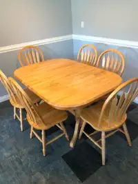 Solid Maple dinning table with 6 chairs.