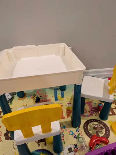 Building block table with Lego DUPLO. The table includes 2 chairs and small storage bins that attach...