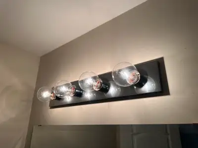 - Modern four-light vanity fixture - fixture colour: Chrome - 25”w x 4-1/4”h - includes 4 clear glas...