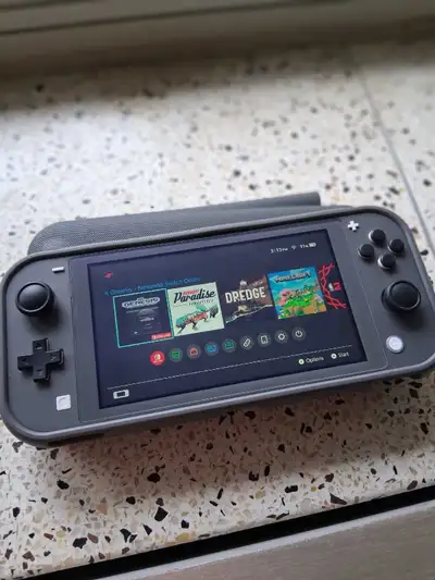 Nintendo Switch Lite (Grey) w/64 GB Micro SD Storage Card, View more