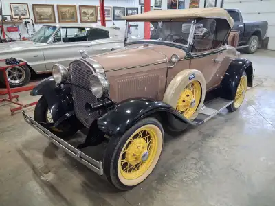 Dual sidemount spare tires. Rumble seat, trunk rack plus trunk. Side mount mirrors. Radiator stone g...