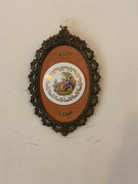 Vintage porcelain brass framed wall plaque.8.1/4”x5.5”.