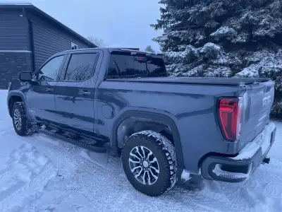 This is a 2021 GMC Sierra 1500 AT4, a rugged and stylish pickup truck, ready for both on and off-roa...