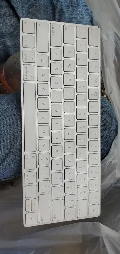 This pre-owned Apple wireless keyboard provides a seamless and compact typing experience for your Ma...