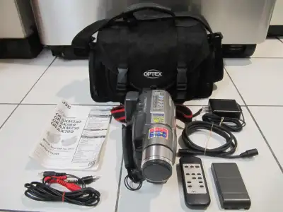 Up for sale is a JVC Model GR-SXM330U Super VHSC Camcorder in near mint hardly used condition. Part...