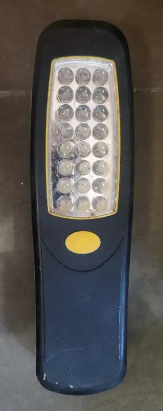 Led flashlight. No burnt out Leds. Uses 3 AA batteries, has magnet and plastic hook on rear to hang...