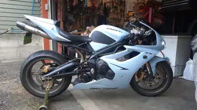 Original model year, in excellent condition. Triple. Custom paint, Akrapovic carbon/titanium exhaust...