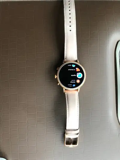 New fossil smart watch , has not been connected to phone yet , has been laying at home , new conditi...