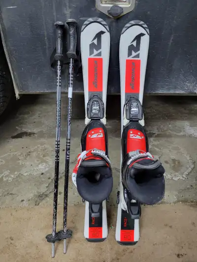 Nordica skis with Marker bindings, 80cm. Nordica ski boots, 18.5, US size 11 for kids. Poles 80cm Th...
