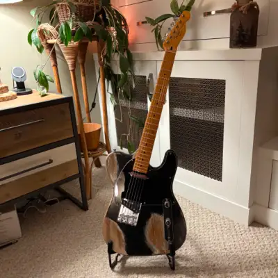 Here is my fictional backstory to this custom guitar I made. "A touring band's Lead Guitarist who ha...
