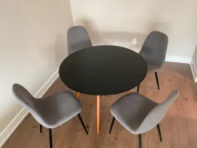 Round Black dining table with 4 grey chairs, View more