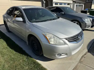 2012 Nissan Altima 2.5l with 342400km. Replaced rotors and pads all around,left front wheel bearing,...