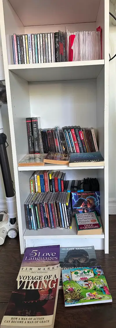 White Bookcase with Assorted Books and Media, View more