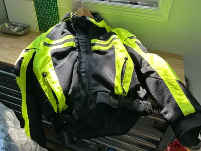 Excellent condition motorcycle jacket with all protective plates. This is a lighter weight jacket co...