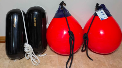 2 Sidewind Fenders 10x26 Black, w/lines & 2 Polyform A-4 Buoy Balls w/lines. Like new, used only rar...