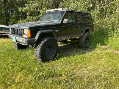 Cherokee comes with good 35” tires 4.5 rough country lift Offset rims Aux power switches Forward and...