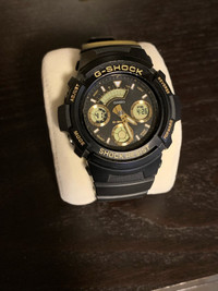 G shock black/gold watch 
