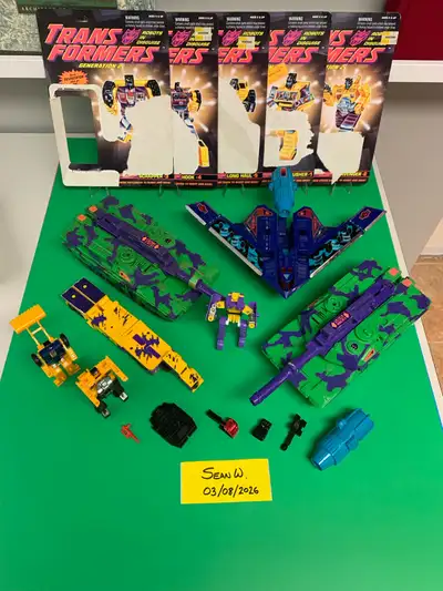 A bunch of G2 Transformers and cardbacks. The Constructicons may be knock-offs, but I am not sure. N...