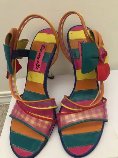 Worn once. These Betsey Johnson heels feature a colourful leather upper, lucite heels, and jewelled...