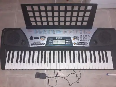 -- YAMAHA PSR-175 Music Keyboard with DJ Voices -- $150 come with power adapter and music book rest...