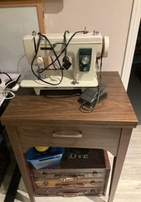 Sewing machine and table