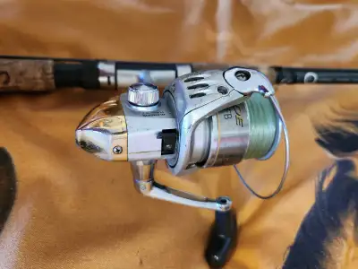 1 Shimano fishing rod 6 feet 6 inches long used but in excellent condition, 1 folding fishing net ne...
