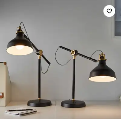 Illuminate your workspace with this stylish IKEA Arstid desk lamp featuring an adjustable arm, black...