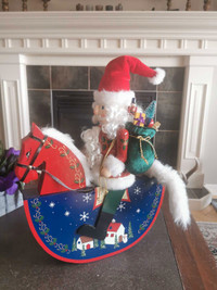 Large wooden nutcracker Santa on a rocking horse 