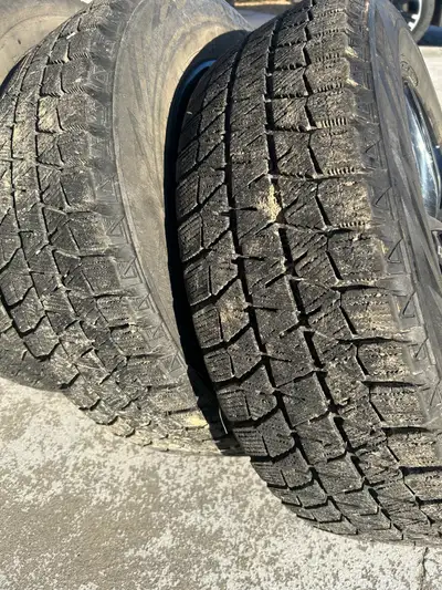 Like new after market 5-120 rims 225/65/17 Blizzacks off 2017 GMC Terrain 50% tread