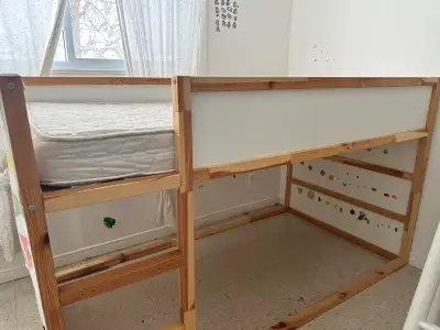 IKEA Kura bed in used, good condition. Can be used as a low bed or flipped into a loft bed. Includes...
