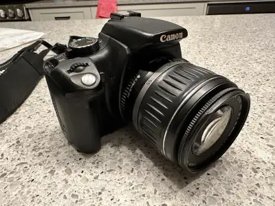 This is a Canon EOS Rebel XT DSLR camera, a great entry-level option for photography enthusiasts. It...