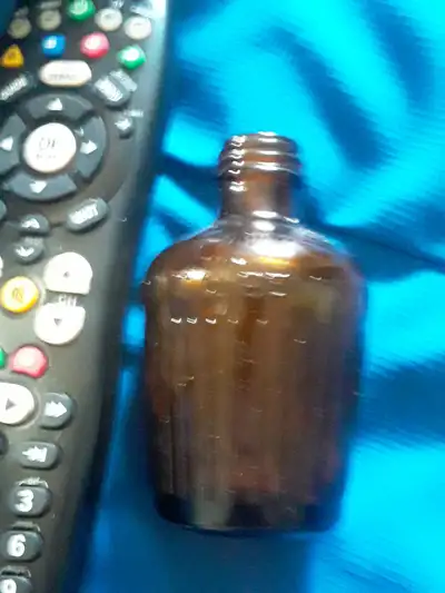 Antique amber poison bottle, Not To Be Taken bottle, ribbed one, View more