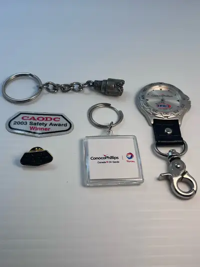I'm offering a collection of used oilfield memorabilia, including keychains, pins, and awards. These...